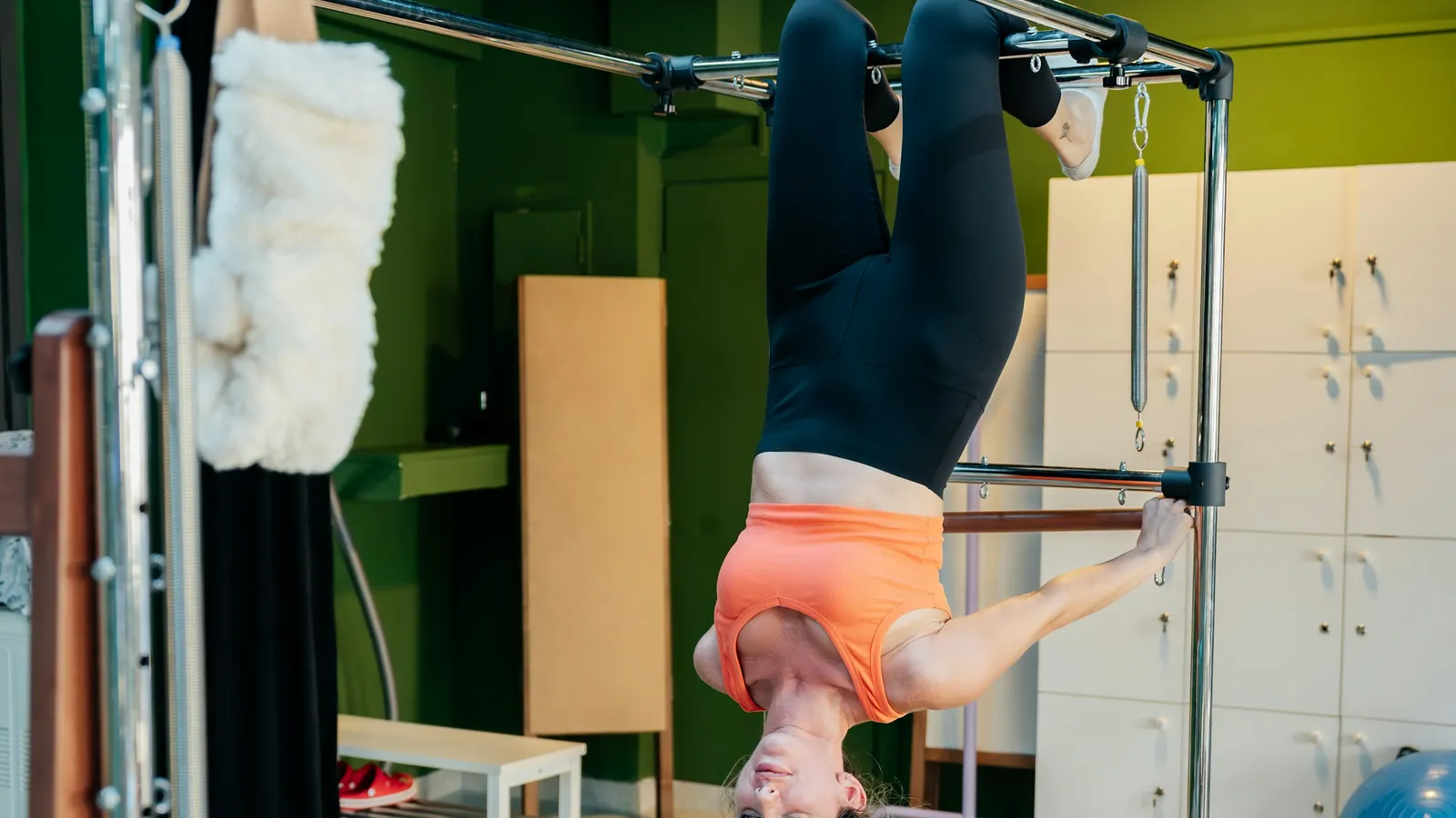 A Pilates instructor's branded client app on a phone, the between-session surface that carries the studio's identity