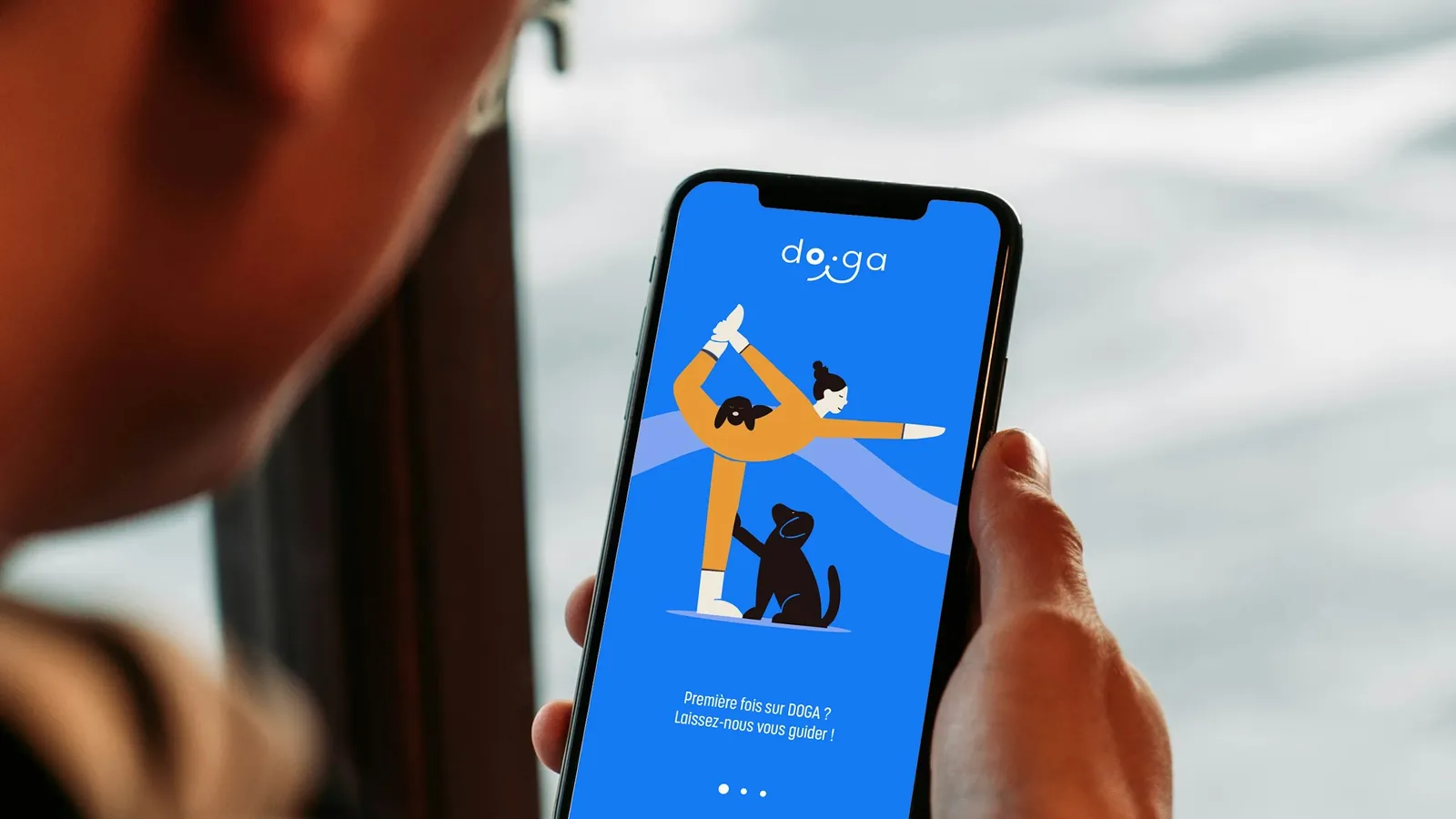 A personal training client opening their coaching app on a phone first thing in the morning